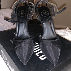 Black mesh pointed heels